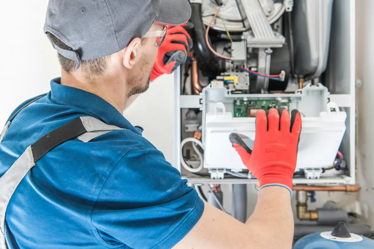 HVAC technician performing annual maintenance on a boiler in Las Vegas