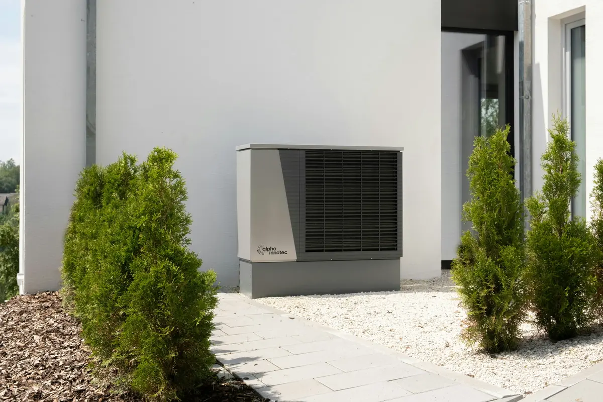 Cold-climate heat pump outdoor unit mounted on Las Vegas home exterior