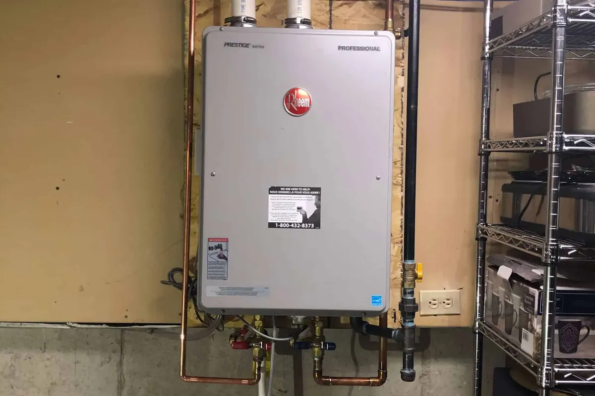 Rheem tankless water heater installed on a wall in a Las Vegas basement